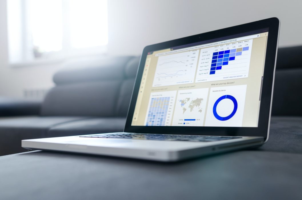 open laptop with graphs