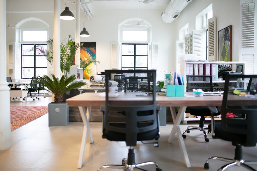 Empty desk in the middle of an office