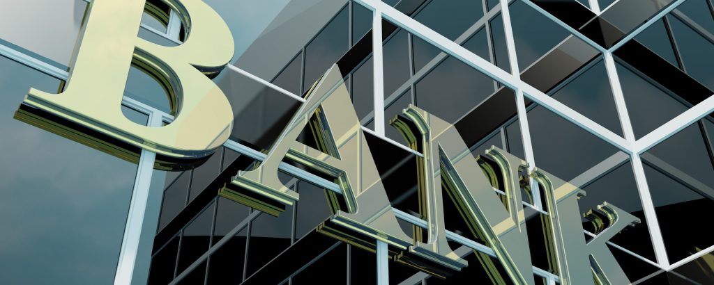 Glass panels with the word BANK spelled out on it.