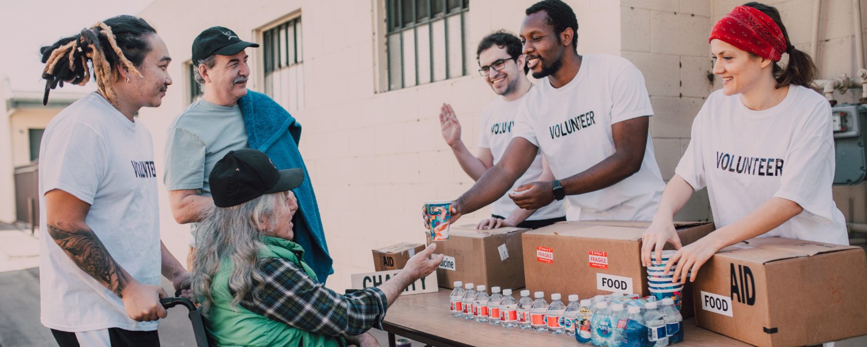 Group of volunteers passing out donations