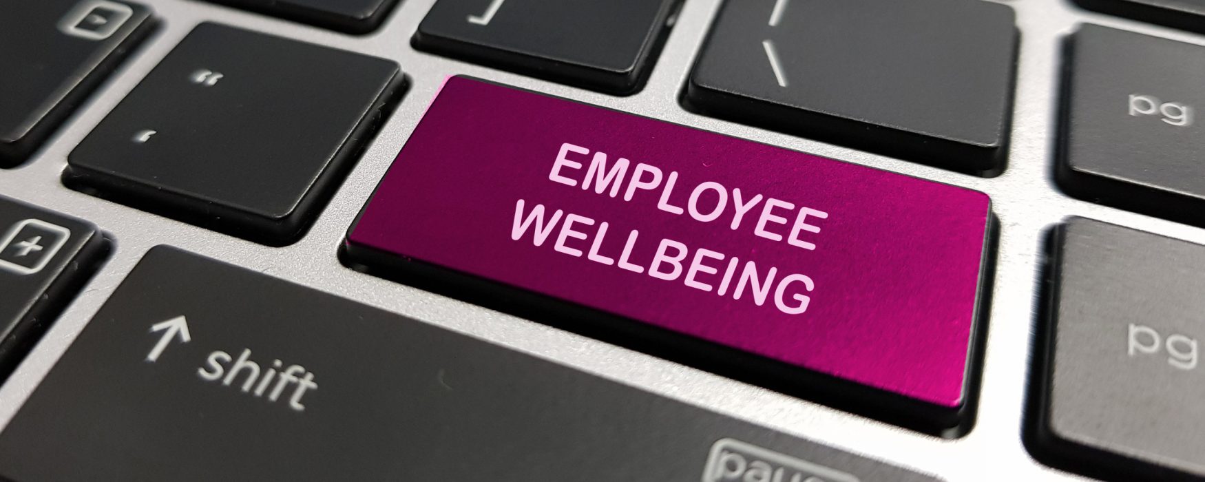 Image of a keyboard key that says employee wellbeing