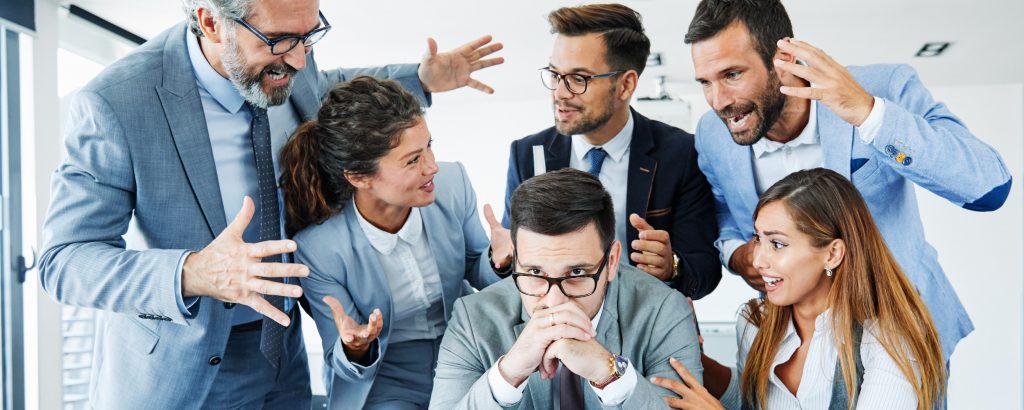 Coworkers engaged in conflict.