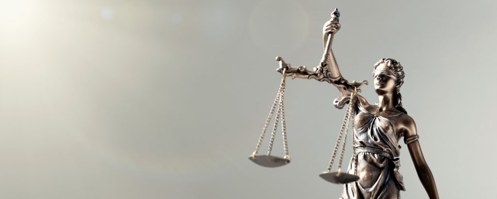 Statue of a woman holding scales