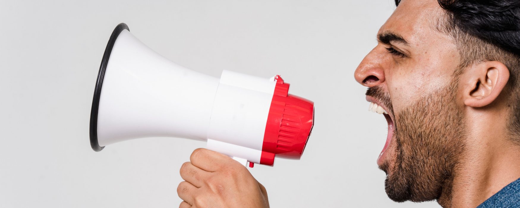 Image of a person shouting into a megaphone
