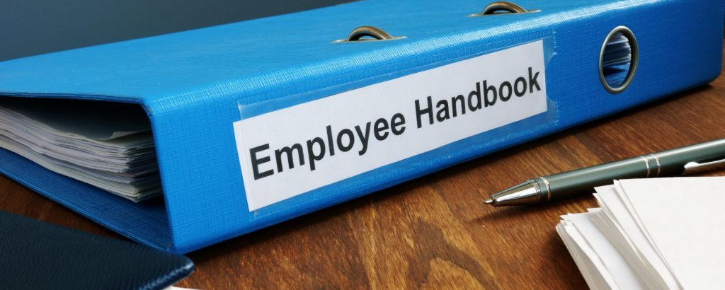 Image of an employee handbook sitting on a table