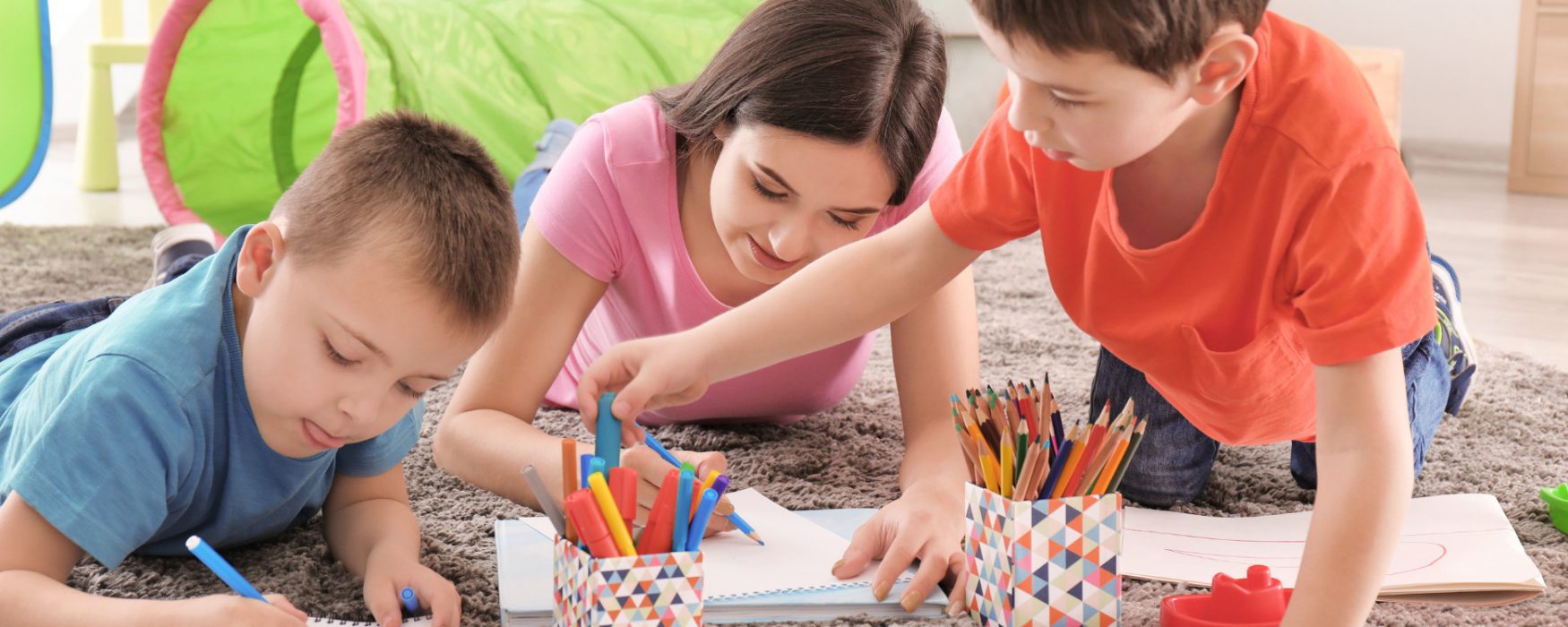 Three children drawing