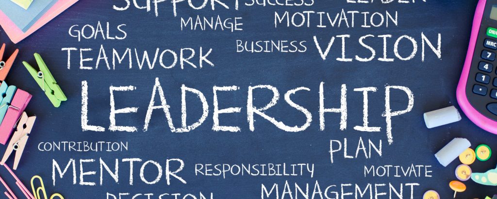 A chalkboard with leadership related words written on it