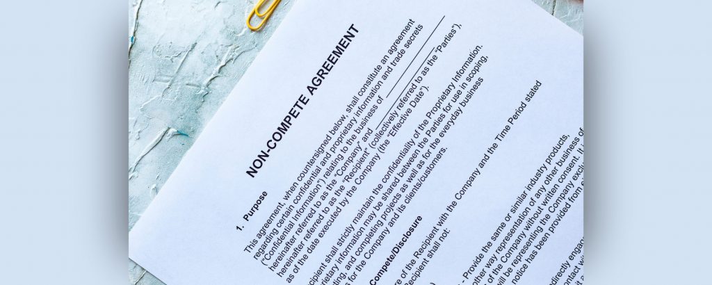 Image of a Non-Compete agreement laying on a desk