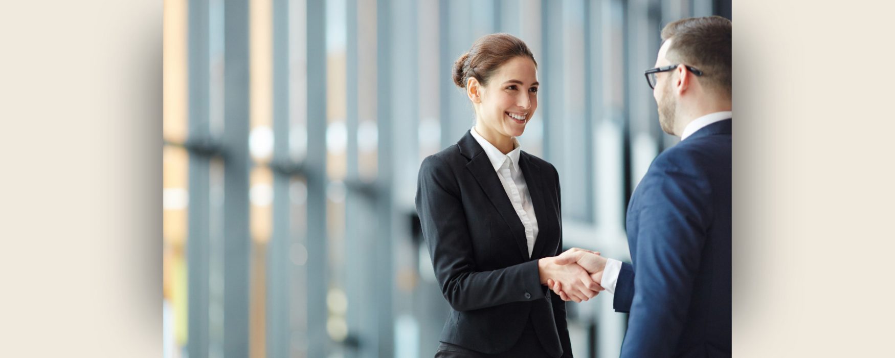 Two people shaing hands after selling a business