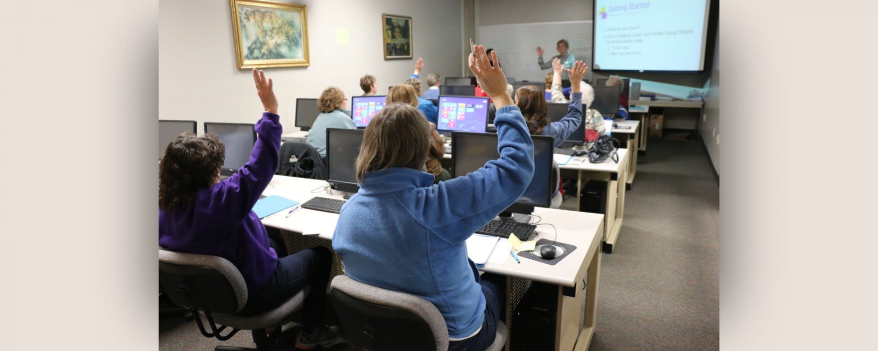 Group of people raising their hands during a training analysis