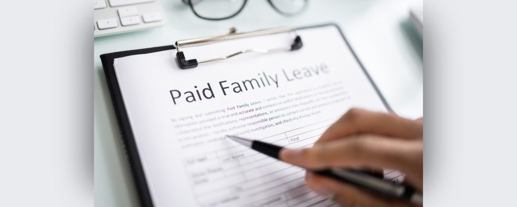 Image of a clipboard holding Paid Family Leave paperwork