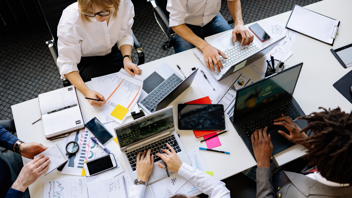 Group of people working at a desk