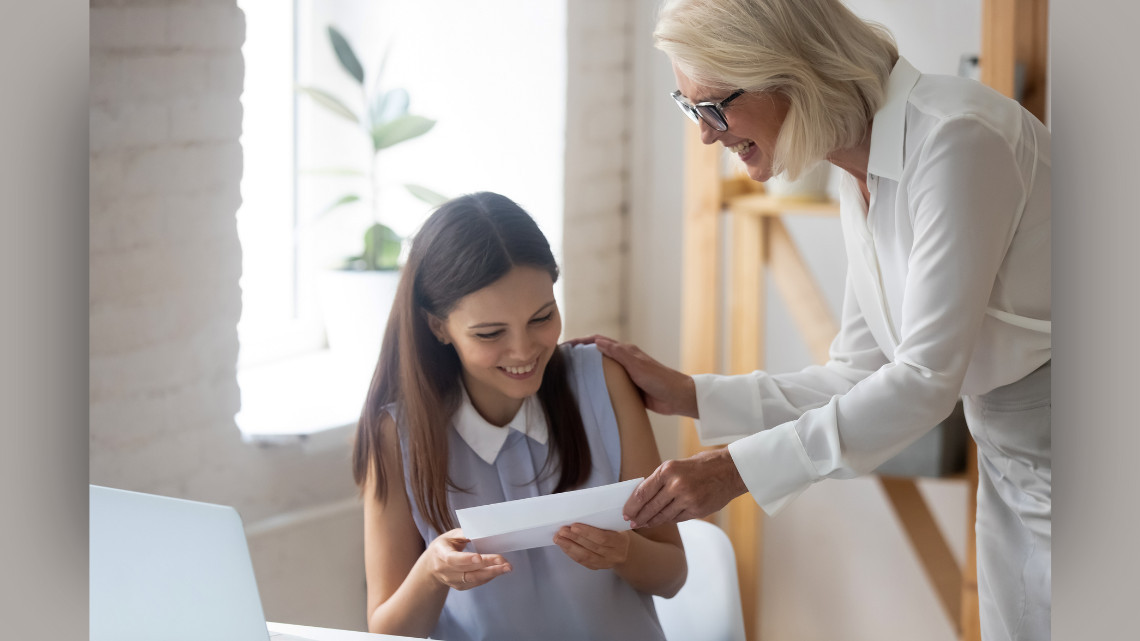 Image of one employee thanking another, displaying gratitude