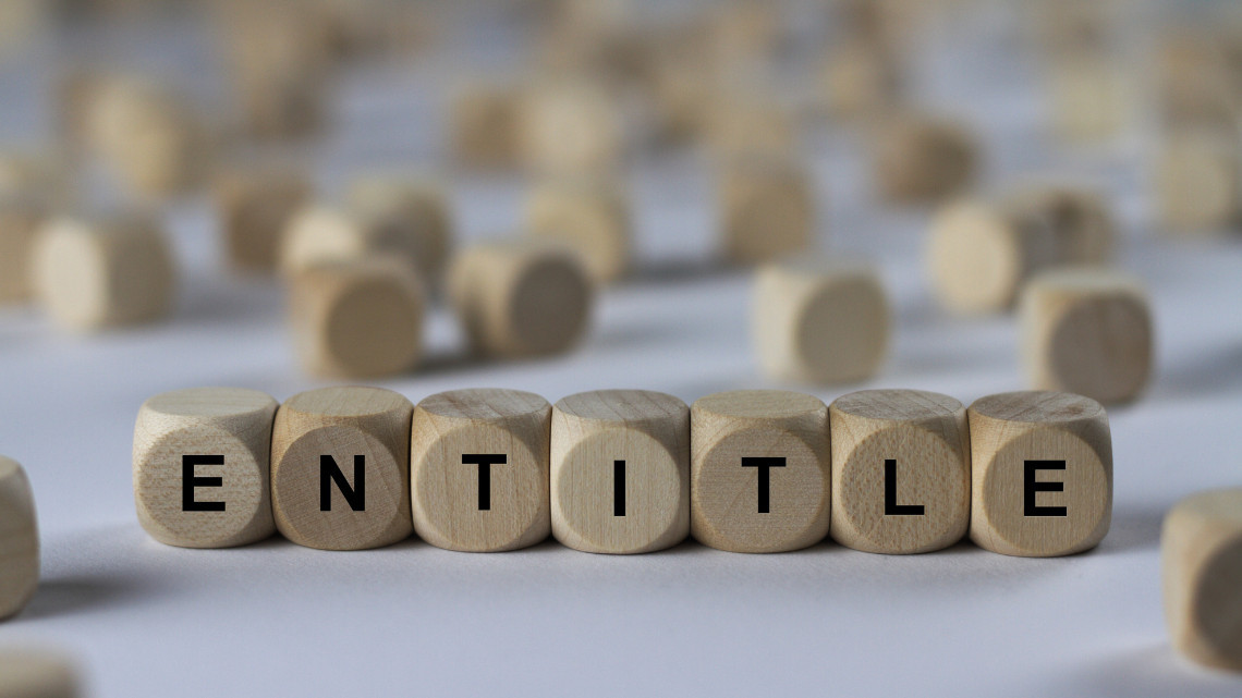 Image of blocks spelling out the word "entitle"