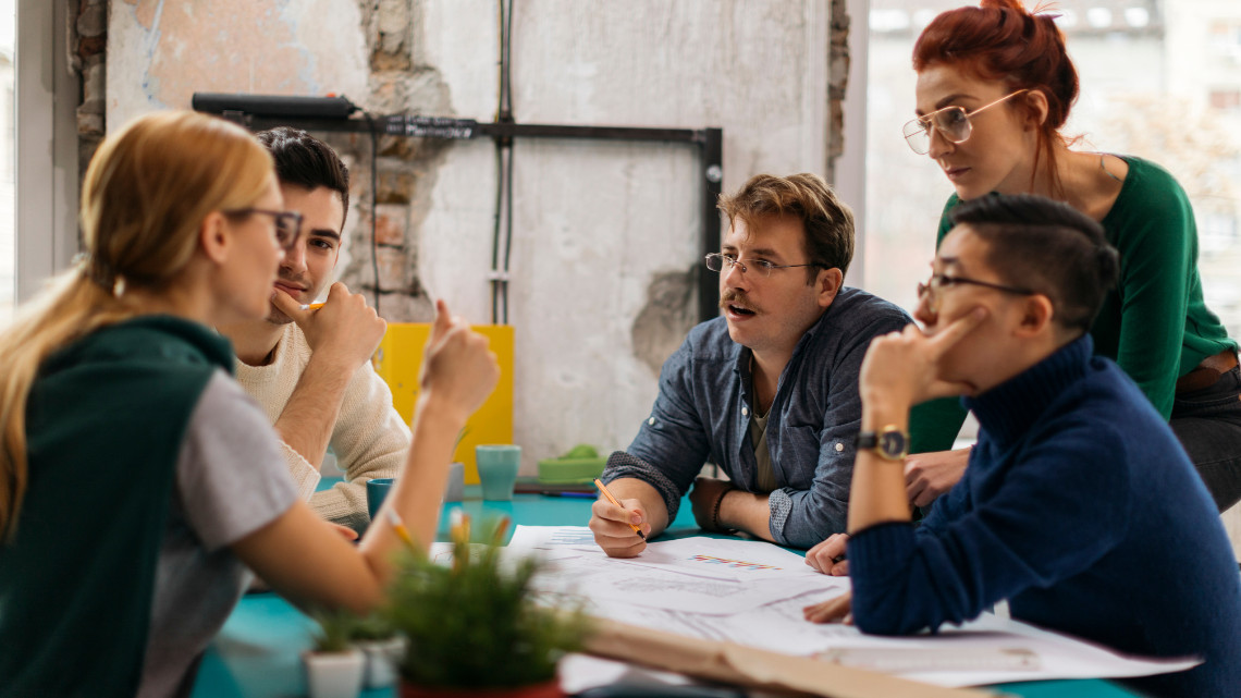 Employees engaged in team conversations