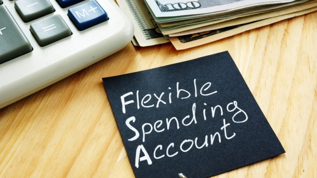 Image of a post it note with FSA, flexible spending account on it