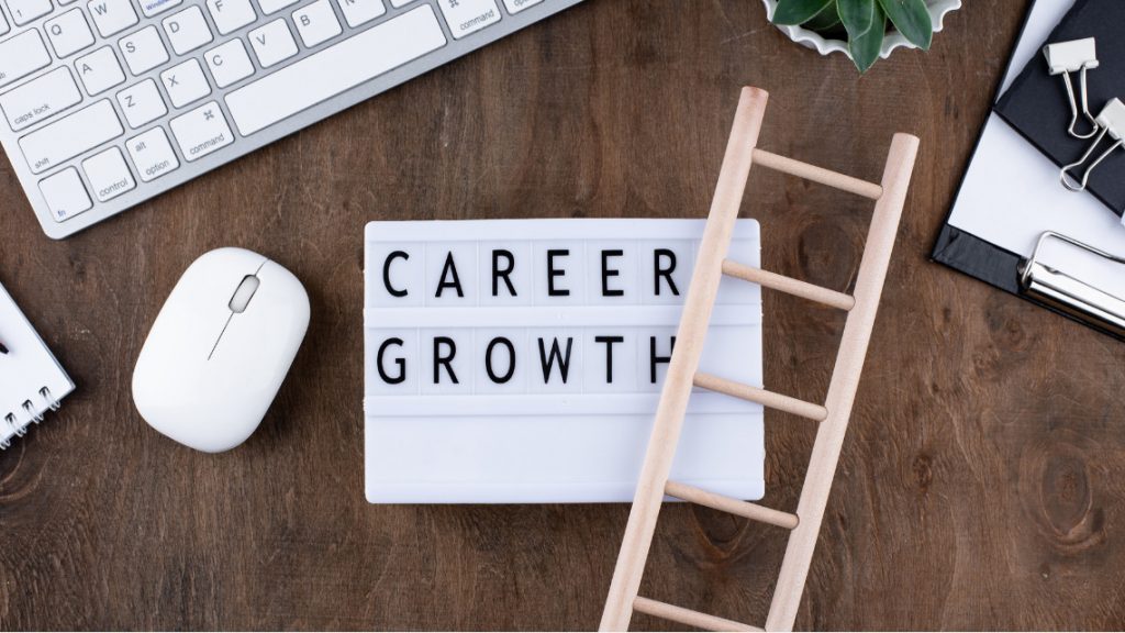 Placeholder image of various desk items and the words 'career growth'