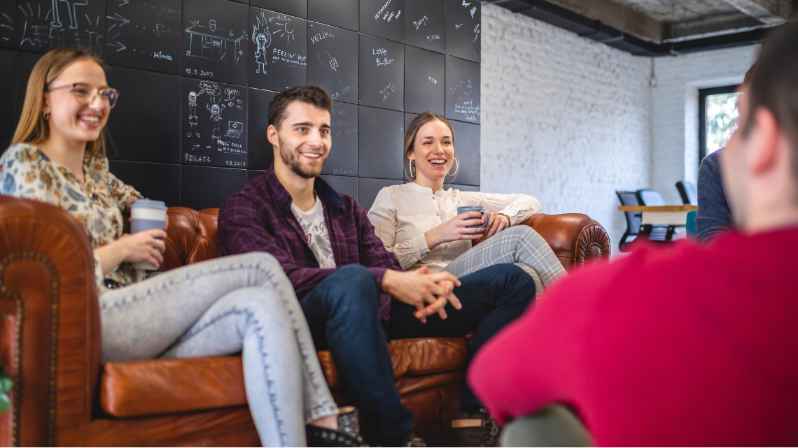 Image of co-workers telling stories