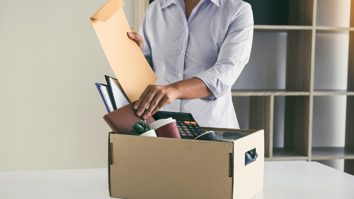 An employee quits, packs a box of belongings
