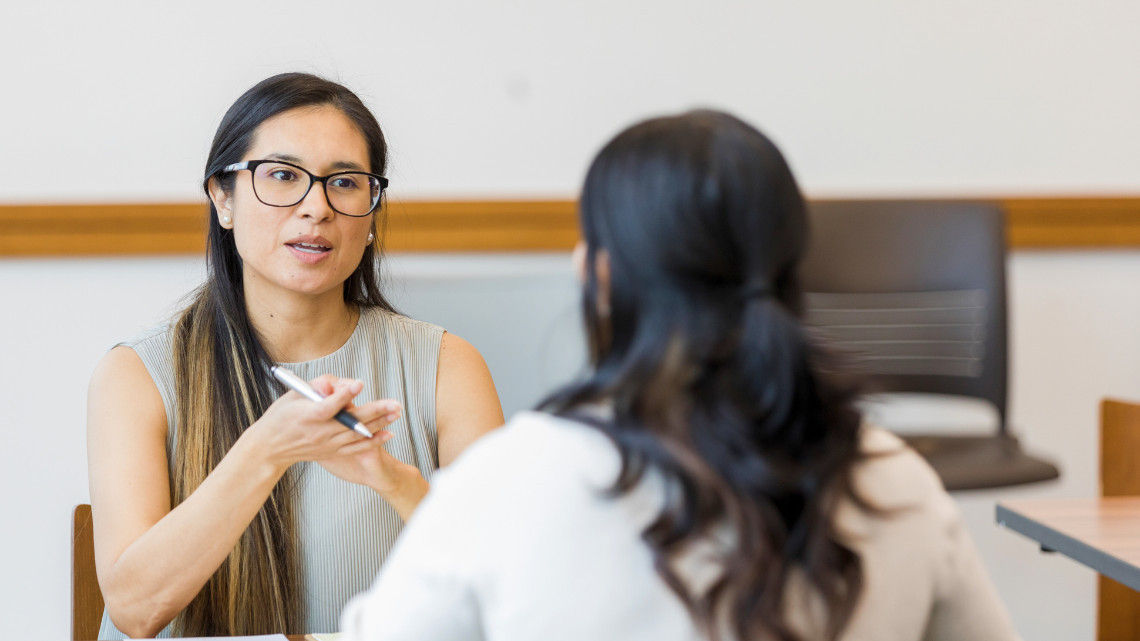 Employees engaging in a performance review