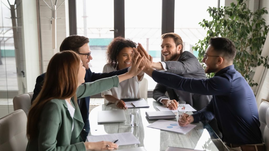 Employees engaged in working with each other