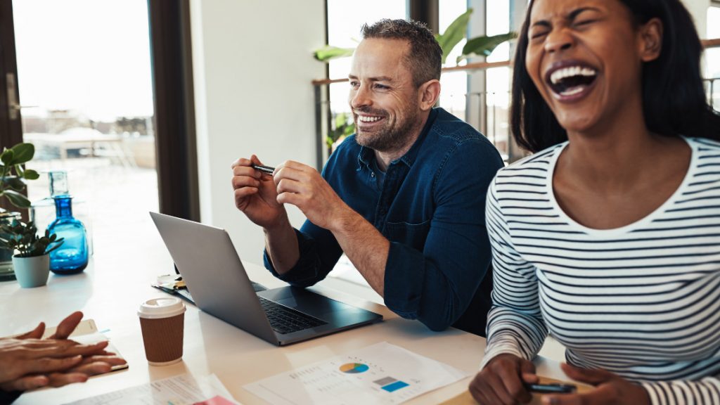 People interacting in a joyful workplace