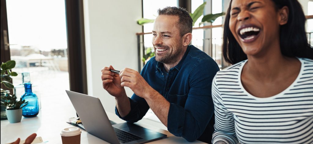 People interacting in a joyful workplace