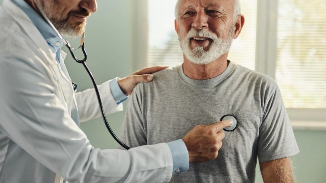doctor checking a persons heart in an effort to prevent heart disease