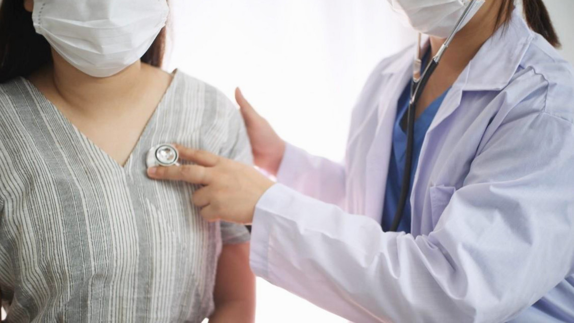 doctor engaged in preventive care with patient