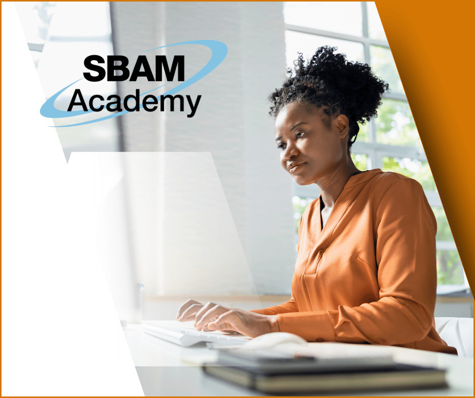 Woman sits at a computer