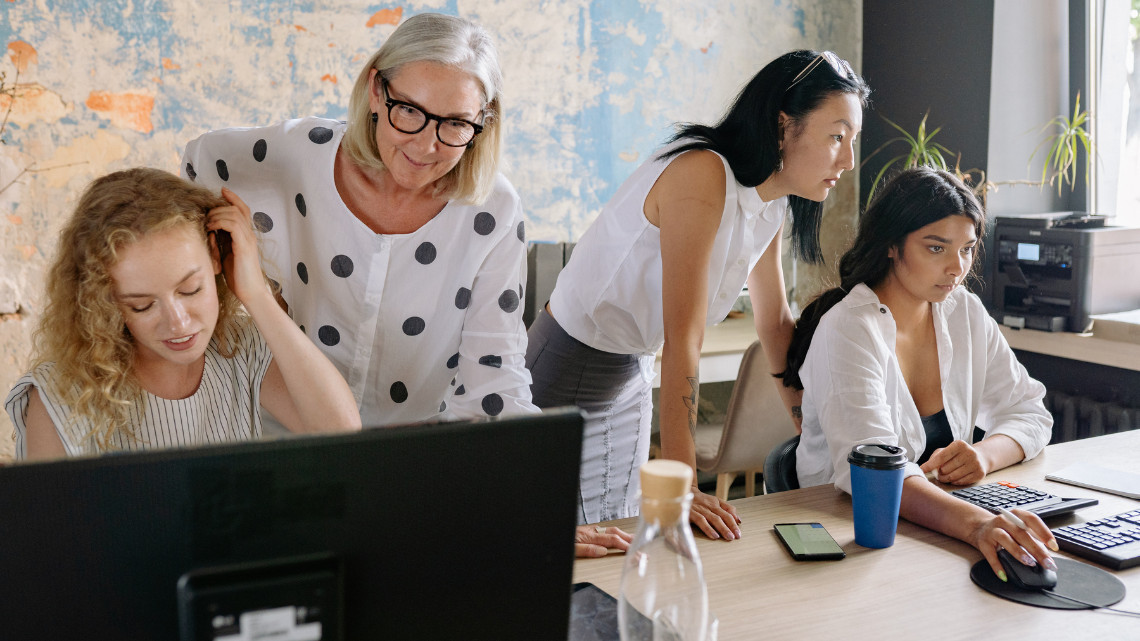 Multigenerational workers working together.