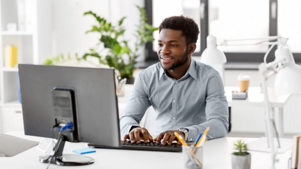 person at computer representing cybersecurity awareness
