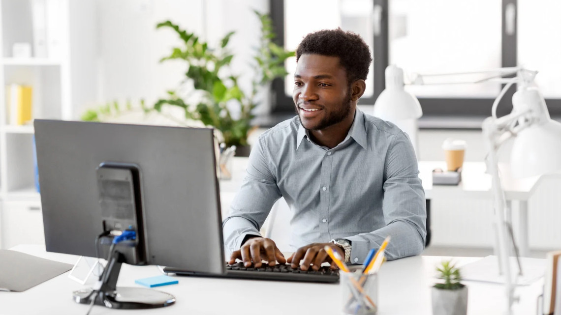 person at computer representing cybersecurity awareness