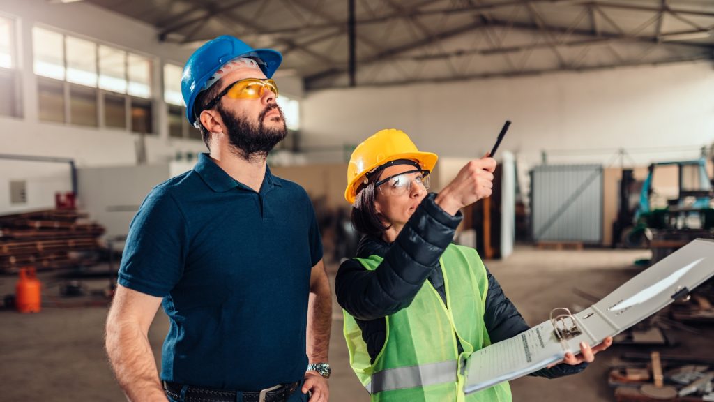 People in the workplace discussing potential workplace hazards